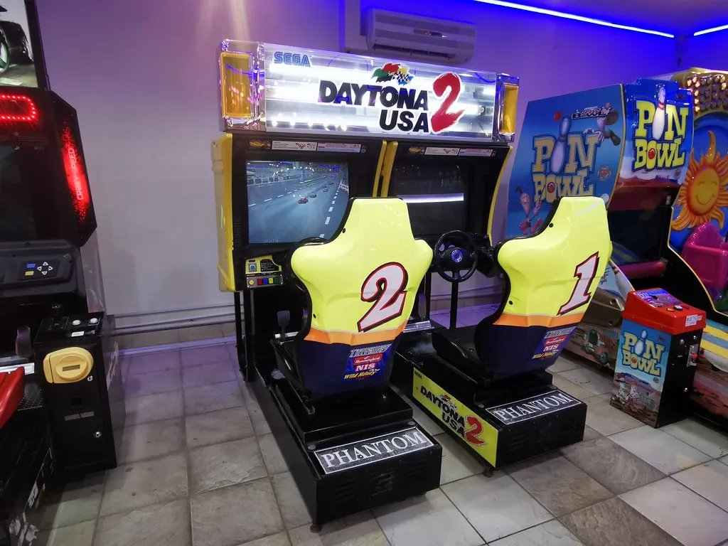 Arcade cabinet glowing in a game space